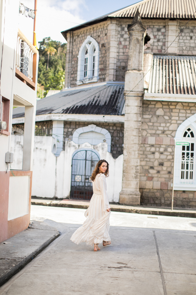 Russian model and blogger Xenia and photographer Samuel Black exploring St Lucia. Xenia wears Sundress official in local fishermen villages.