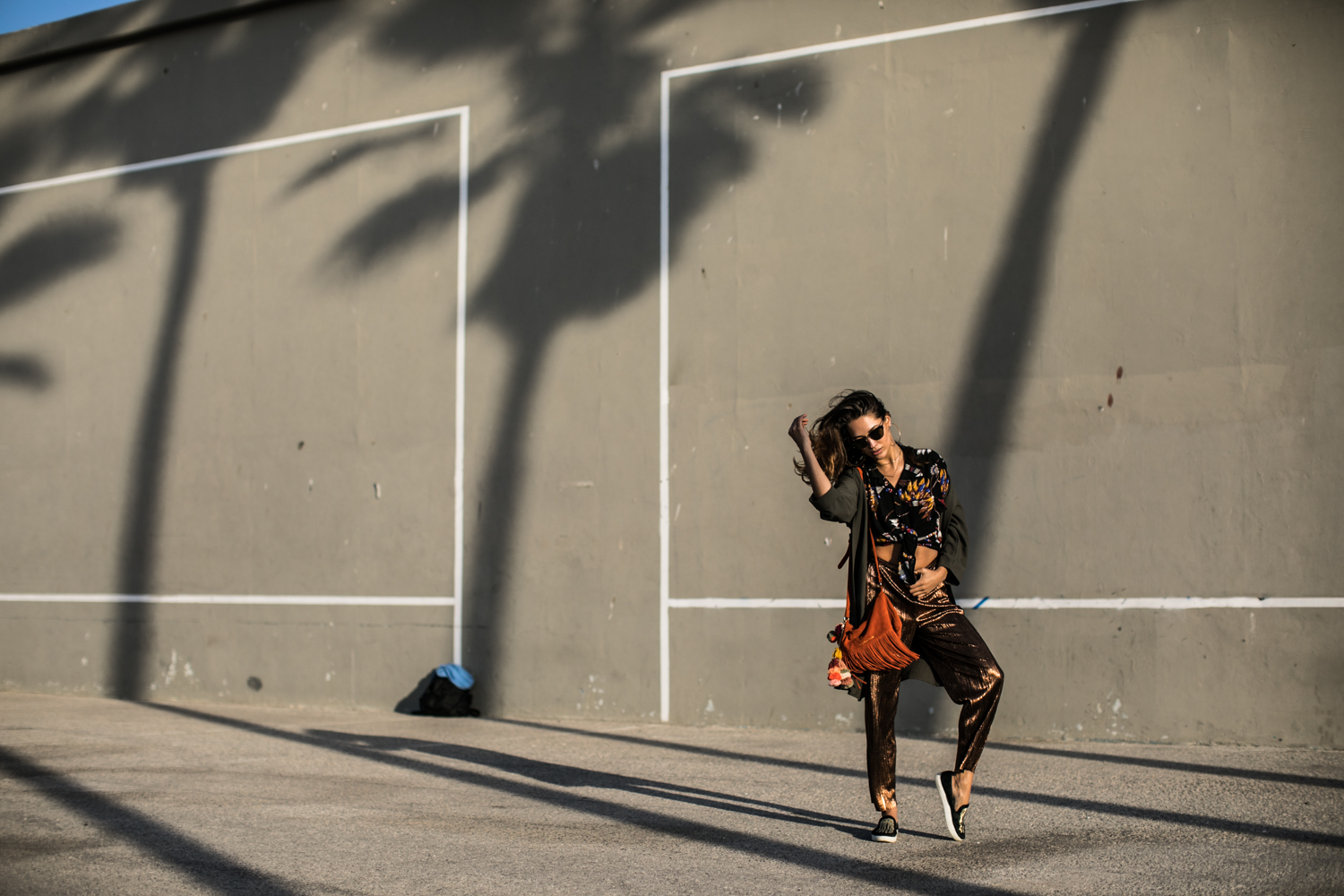 Fashion photographer Samuel Black shoots an editorial with model and streetstyle blogger Xenia Mz in Venice Beach, California