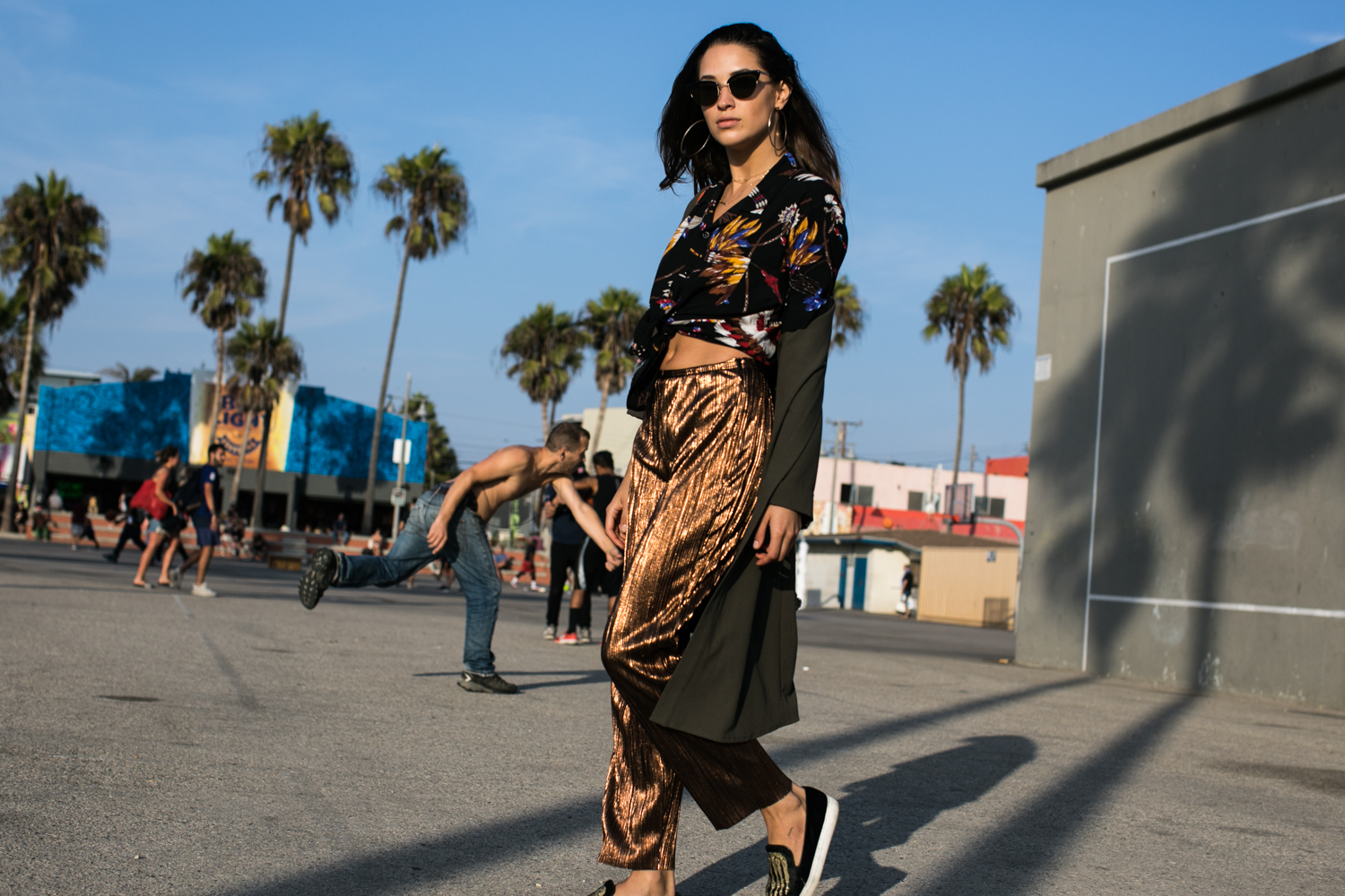 Fashion photographer Samuel Black shoots an editorial with model and streetstyle blogger Xenia Mz in Venice Beach, California